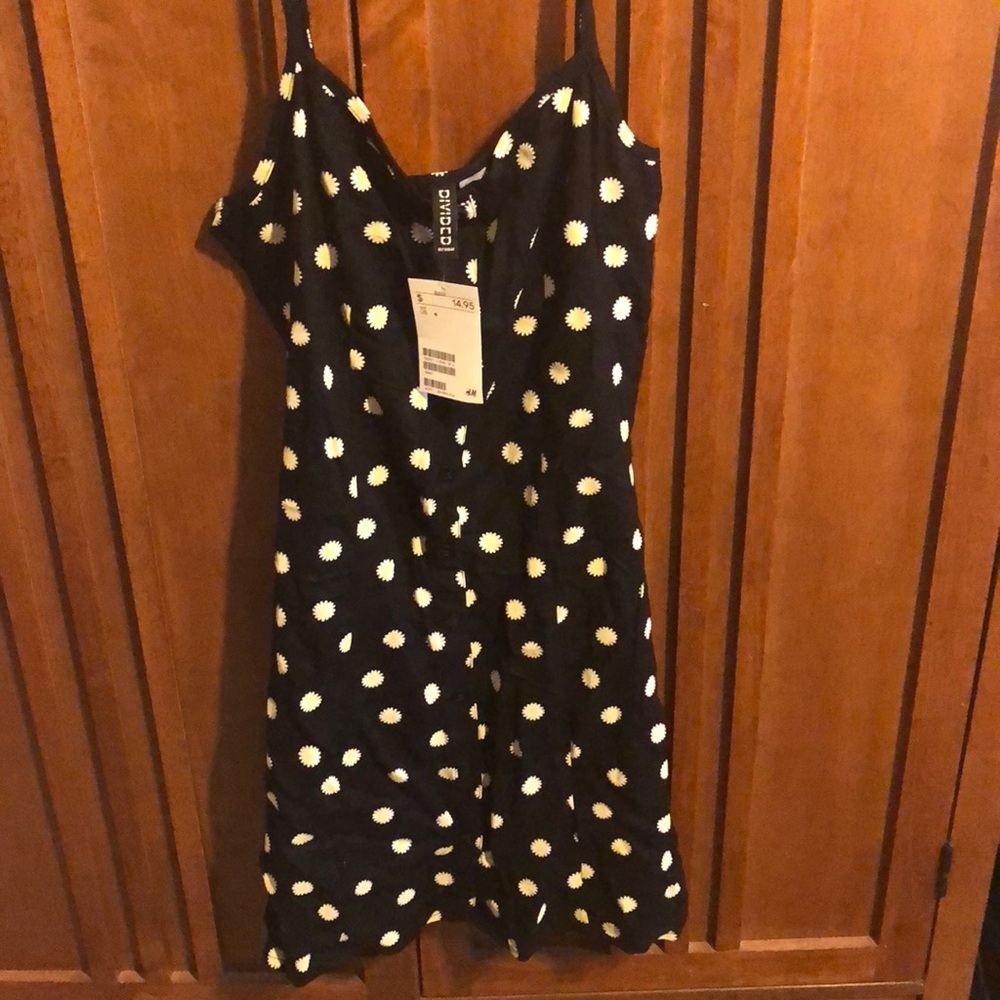 Cute little sun dress. Size 4, fits like a 2  H&M